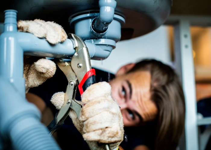 plumber fixing plumbing issues