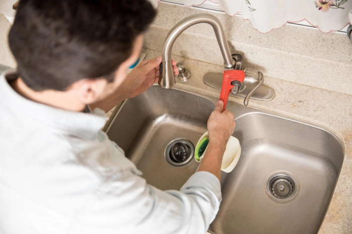 man doing plumbing fixtures